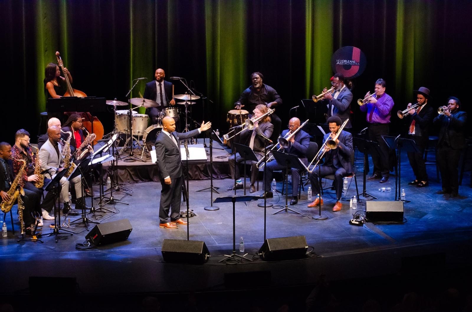 Adonis Rose conducting the New Orleans Jazz Orchestra, a full big band on stage